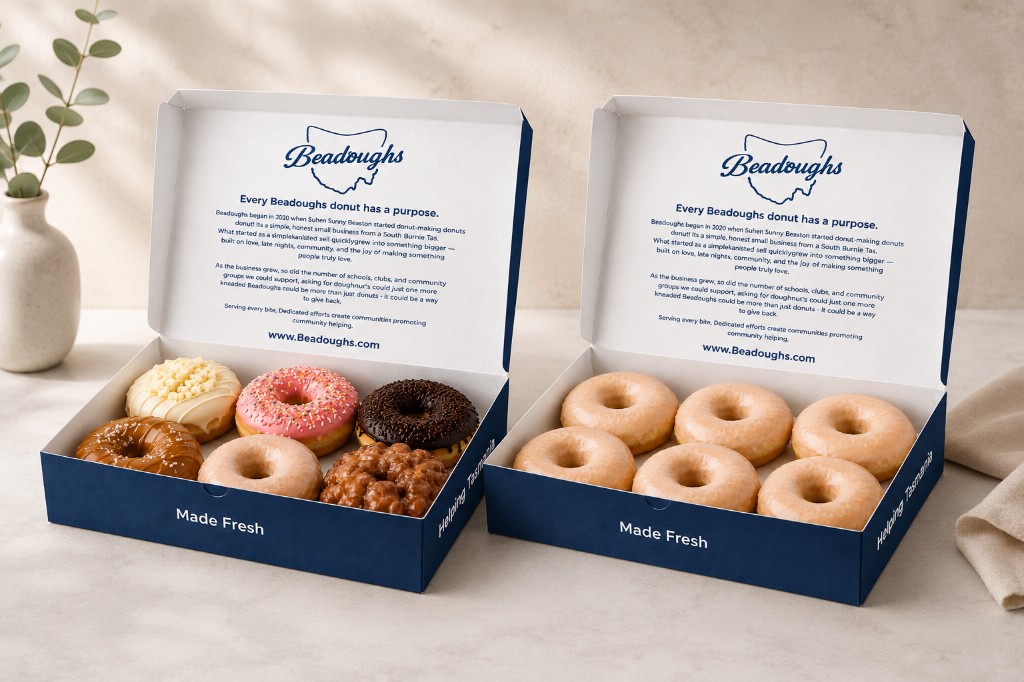 Two open Beadoughs donut boxes with assorted and glazed donuts
